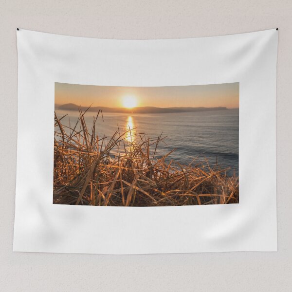 Item preview, Sunrise from behind the grass on the mountain at umina on nsw central coast designed and sold by Geoff Wols.