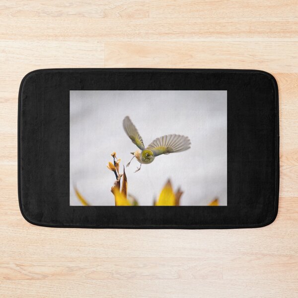 Item preview, bird in flight heading towards camera with wings outstretched above flowers just feeding on. designed and sold by Brian Scantlebury.