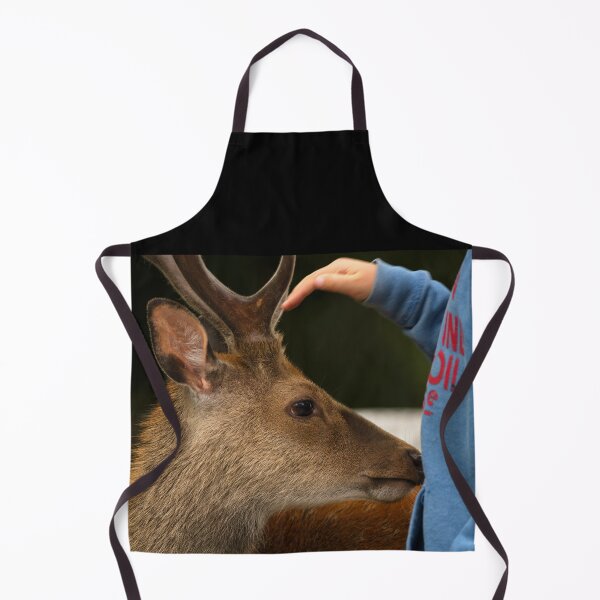 Item preview, The child cuddling friendly young deer in Killarney National Park, County Kerry, Ireland designed and sold by AlbertMi.