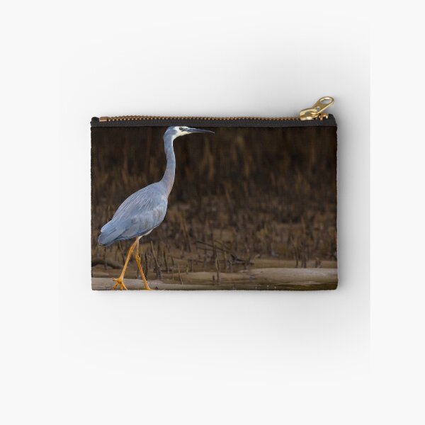 Item preview, White-faced Heron (Egretta novaehollandiae) walking on edge of a creek with mangrove roots in the background designed and sold by Trent Townsend.