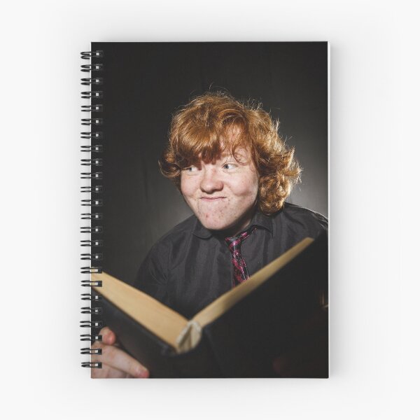 Item preview, Freckled red-haired teenage boy reading book, education concept, isolated on black background designed and sold by Alexander Sorokopud.
