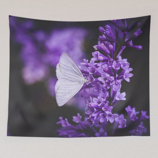 Item preview, Macro of a white butterfly on purple lilac flowers. Moody, dark and faded edit with muted background. Shallow depth of field, soft focus and blur designed and sold by macroviewpoint.