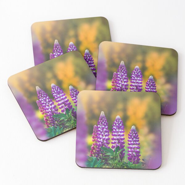 Item preview, Macro of three wild lupine flowers on orange background. Shallow depth of field, soft focus and blur designed and sold by macroviewpoint.