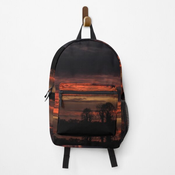 Item preview, A beautiful red sunset and clouds over a forest in Ireland designed and sold by AlbertMi.