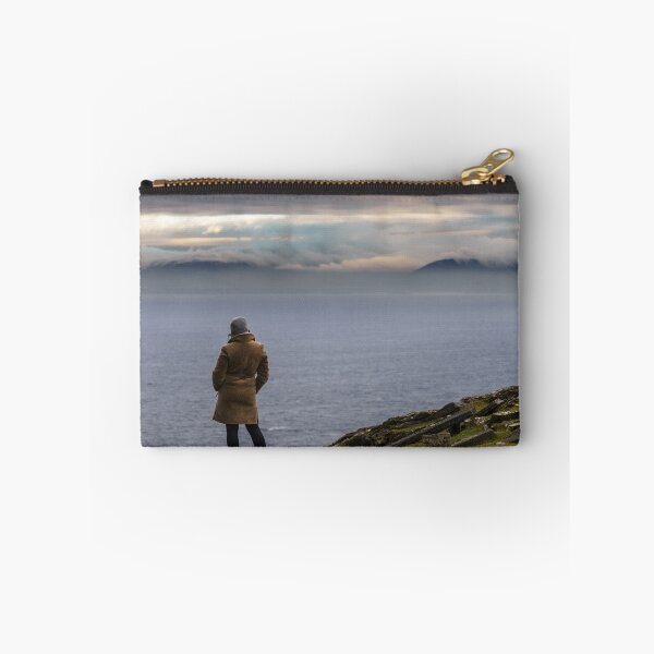 Item preview, Woman enjoying view of ocean with mountains and beautiful cloudscape, from Slieve League mountain on the Atlantic coast of County Donegal, Ireland designed and sold by AlbertMi.