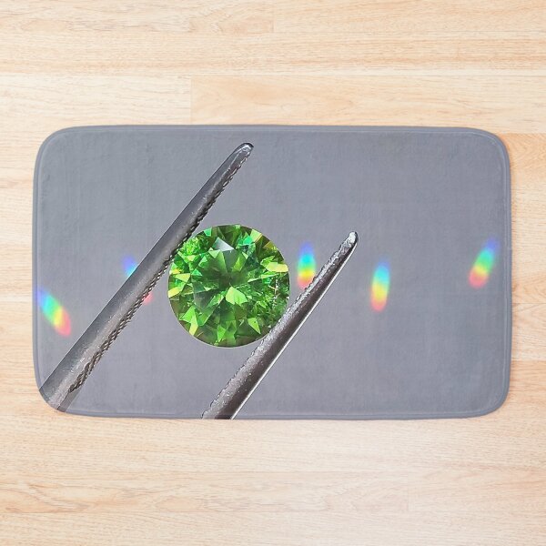 Item preview, rainbow green garnet gemstone in tweezers designed and sold by QueenofCarbon.