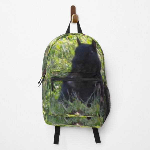 Item preview, Black squirrel sitting up on the grass designed and sold by AlicesArtistry.
