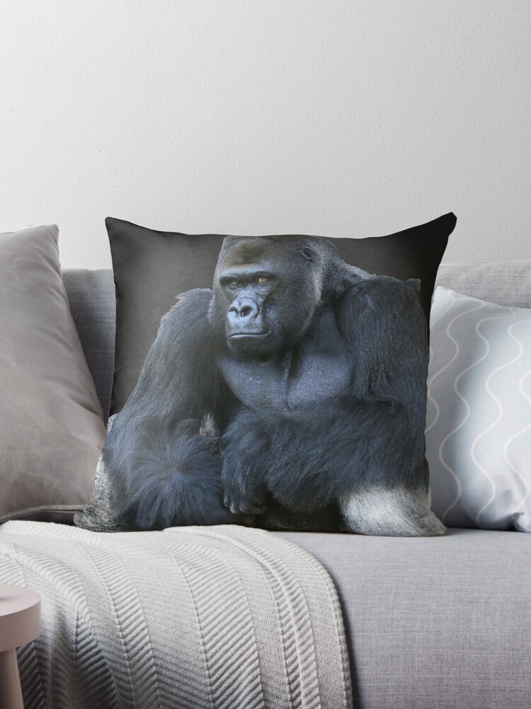 Throw Pillow A large male silver of back gorilla sitting 