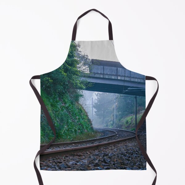 Item preview, Lonely train tracks disappearing under a bridge and into a foggy morning landscape designed and sold by James-Cole.
