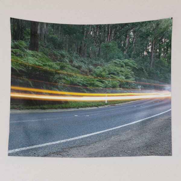 Item preview, Car lights streaking past on a quiet country road in the Australian rainforest designed and sold by James-Cole.