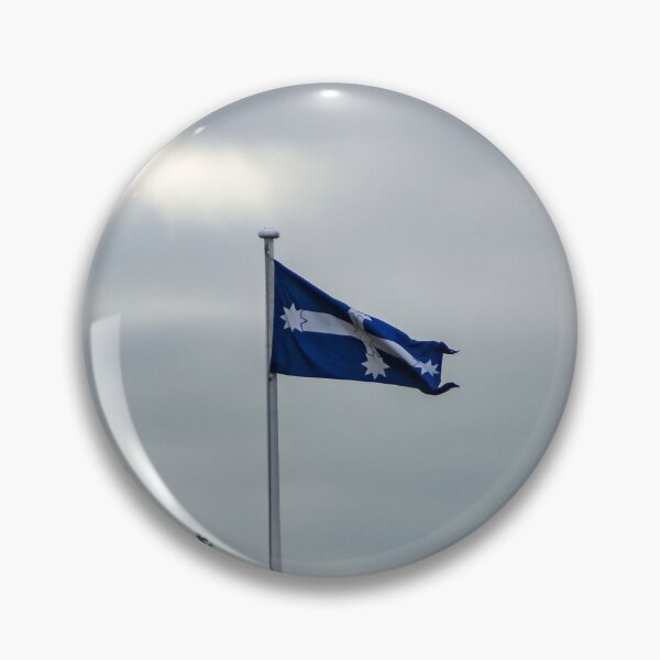 Item preview, Eureka flag flying in the wind on a gloomy overcast day in the old Ballarat cemetery designed and sold by James-Cole.
