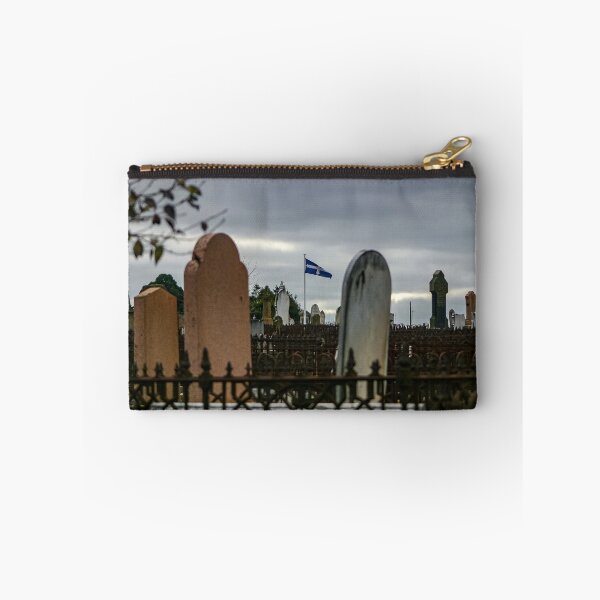Item preview, Eureka flag flying between headstones in the Ballarat old cemetery designed and sold by James-Cole.