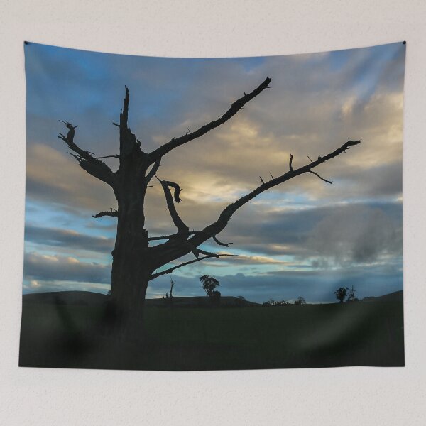 Item preview, Silhouetted tree skeleton against a dramatic sky designed and sold by James-Cole.