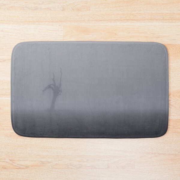Item preview, Creepy silhouette of dead tree stump stands alone in a foggy field designed and sold by James-Cole.