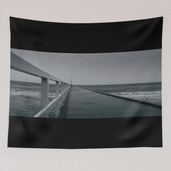 Item preview, A lonely desolate pier juts out to a moody sea on a sombre rainy day in Black and White designed and sold by James-Cole.