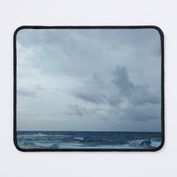 Choppy waves race for the shore under a cloudy winter sky Mouse Pad