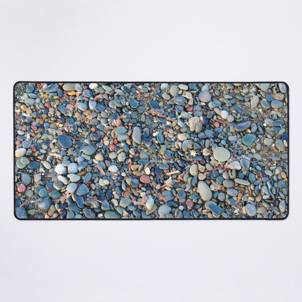 Stones and pebbles on the beach Desk Mat