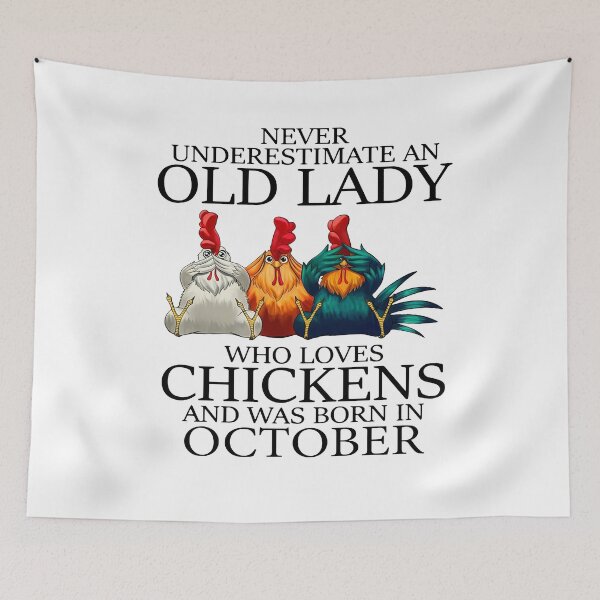 Item preview, NEVER UNDERESTIMATE AN OLD LADY WHO LOVES CHICKENS AND WAS BORN IN OCTOBER SHIRT designed and sold by JARELYSHOP.
