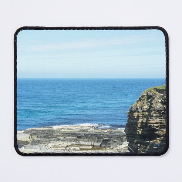 Rocks and raised ledge in sea Mouse Pad