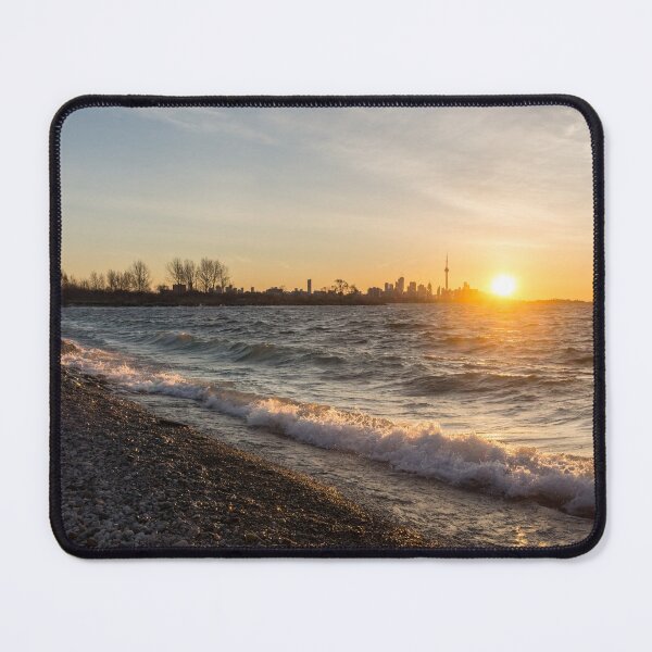 Item preview, Breaking Wave Sunrise - Toronto Skyline Behind Rough Lake Ontario designed and sold by Georgia Mizuleva.