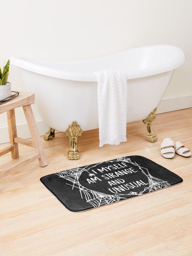 Bath Mat, I Myself Am Strange And Unusual Beetlejuice Movie Quote Lydia Deetz Spider Web designed and sold by GRAPHICxBOMB