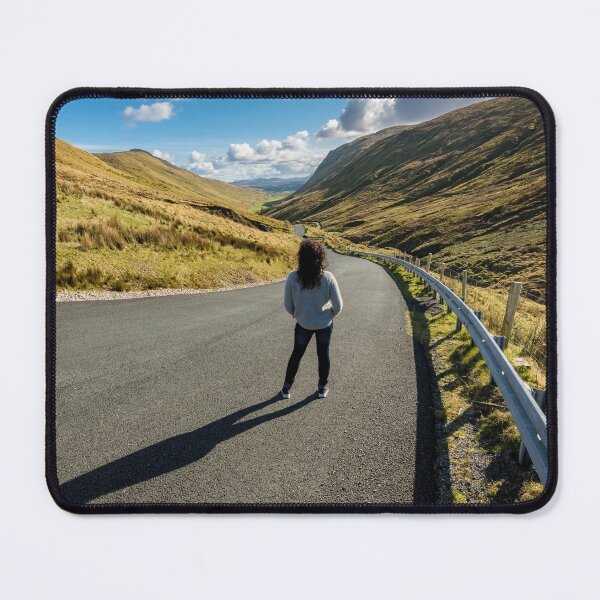 Item preview, A young beautiful woman with long curly hair stands on the highway of the Glengesh Pass between the mountains in Ardara, County Donegal, Ireland designed and sold by AlbertMi.