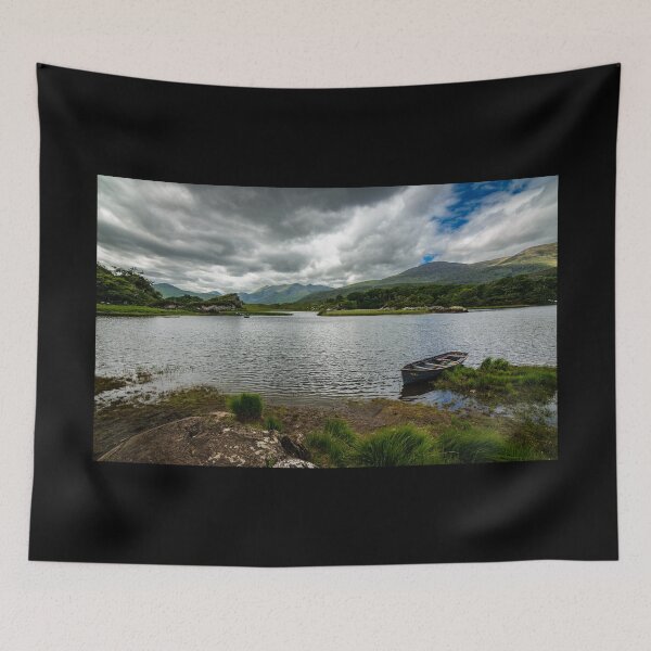 Item preview, A boat on a lake by a mountains under a cloudy sky in Killarney National Park, near the town of Killarney, County Kerry, Ireland designed and sold by AlbertMi.