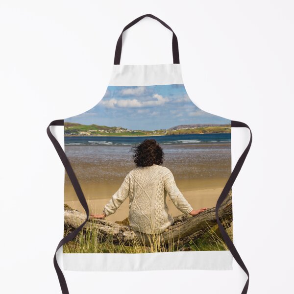 Item preview, A woman rests on the shore and enjoys views of the Atlantic Ocean in Ireland designed and sold by AlbertMi.