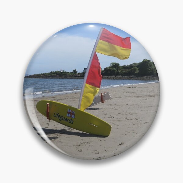 Item preview, Red and yellow lifeguard flag and board on the beach. designed and sold by S-and-W-4ever.