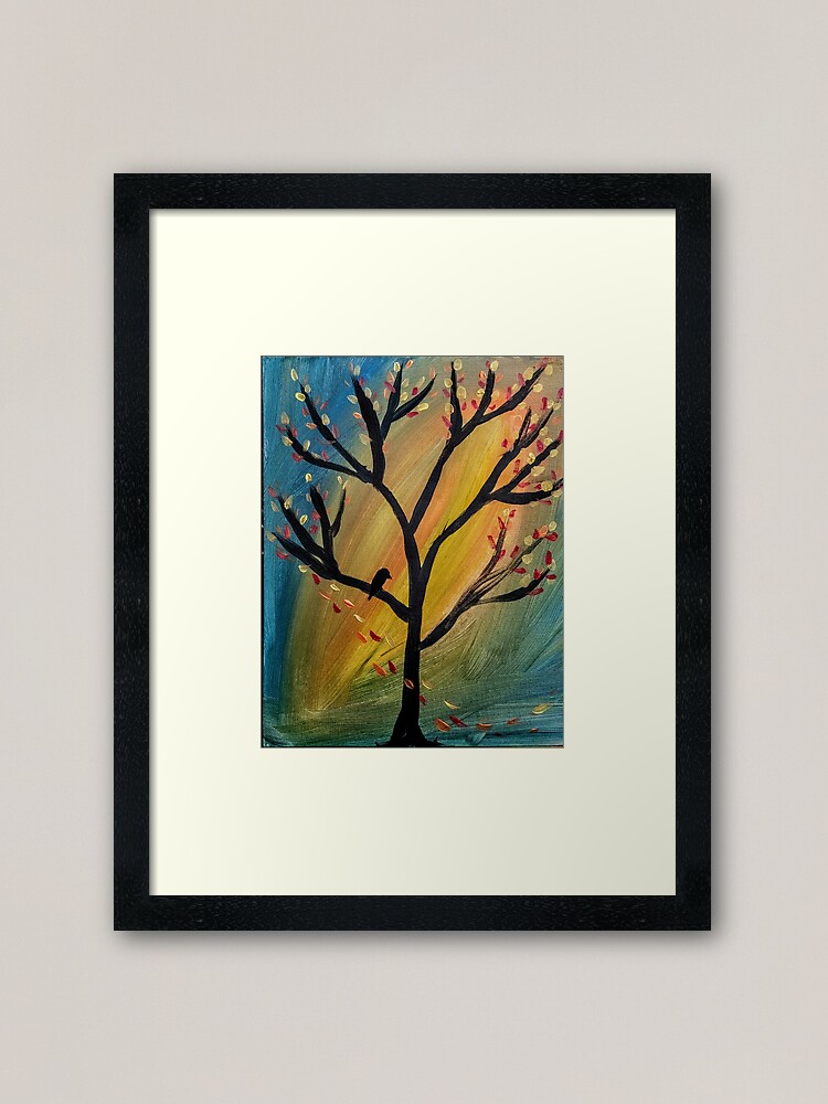 Alternate view of Black bird in the tree as the wind blows leaves off the tree Framed Art Print