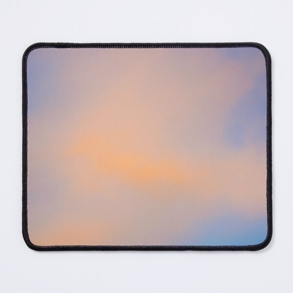 Item preview, Fluffy pinky orange clouds against a blue sky at sunset designed and sold by James-Cole.