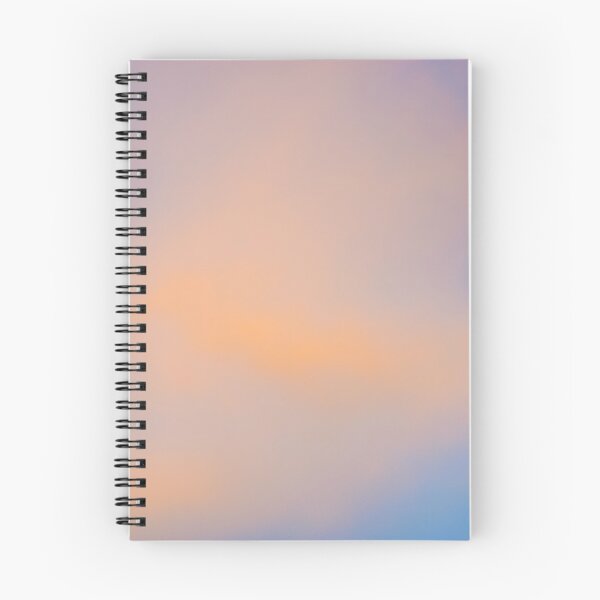 Item preview, Fluffy pinky orange clouds against a blue sky at sunset designed and sold by James-Cole.
