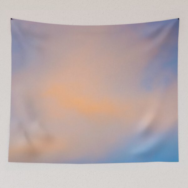 Item preview, Fluffy pinky orange clouds against a blue sky at sunset designed and sold by James-Cole.