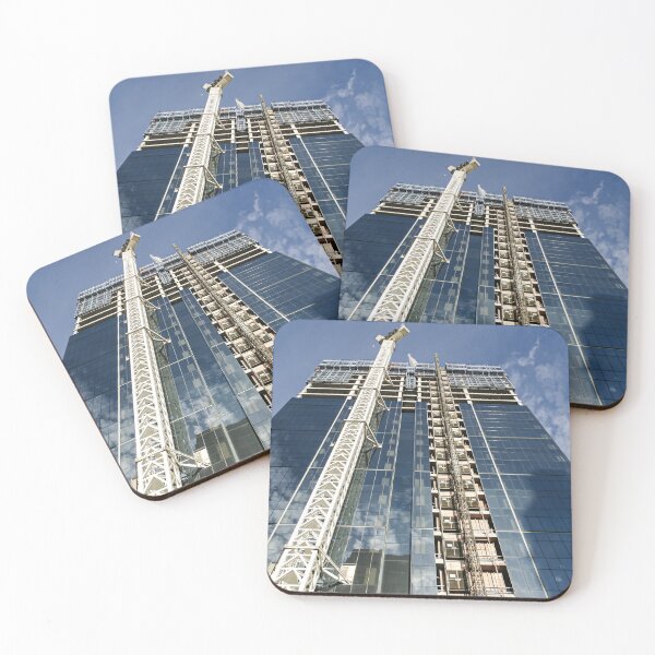 Item preview, A new high-rise under construction reflecting blue skies and fluffy clouds in the glass windows designed and sold by James-Cole.