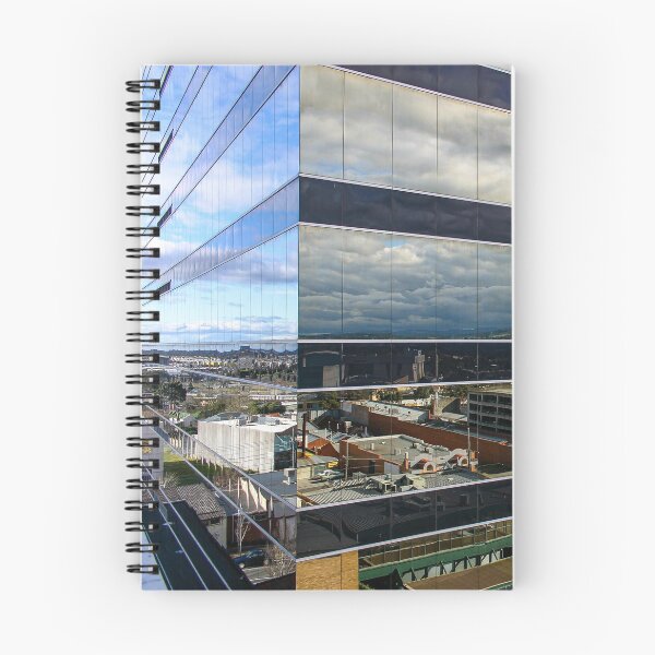 Item preview, A cloudy sky reflected on the corner of a glass high-rise building designed and sold by James-Cole.