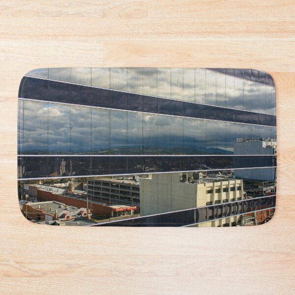 Item preview, A cloudy sky reflected on the glass windows of high-rise building designed and sold by James-Cole.