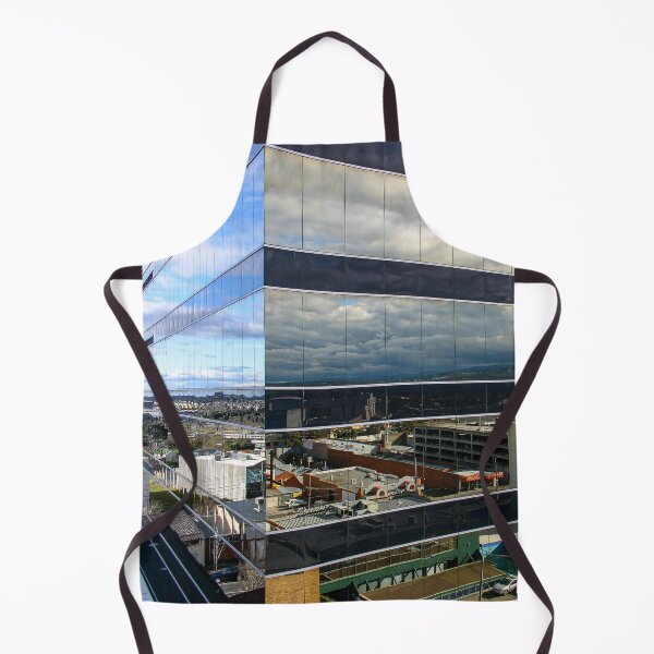 Item preview, A cloudy sky reflected on the corner of a glass high-rise building designed and sold by James-Cole.