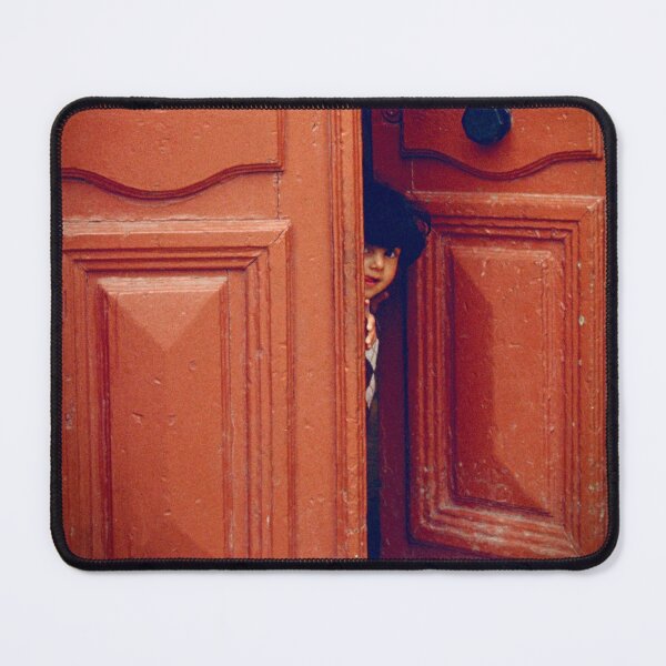 Item preview, Girl Peers through a Maltese Doorway in Valetta designed and sold by JonDelorme.