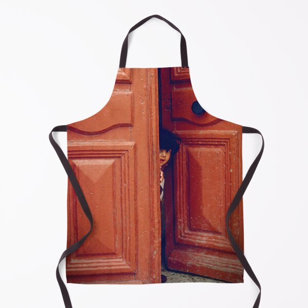 Item preview, Girl Peers through a Maltese Doorway in Valetta designed and sold by JonDelorme.