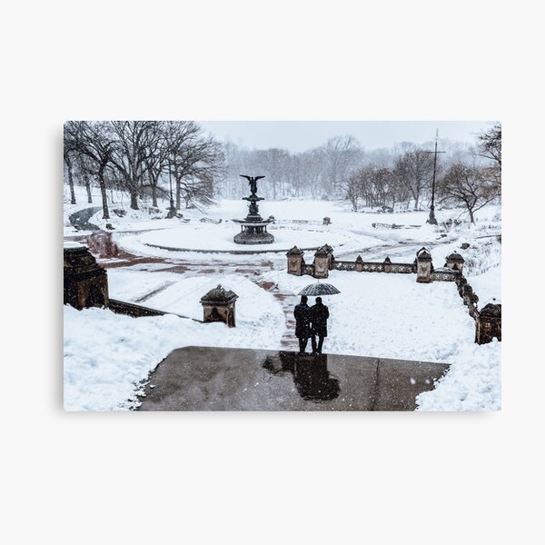 Winter in Central Park in New York City with Bethesda Fountain covered by snow Canvas Print