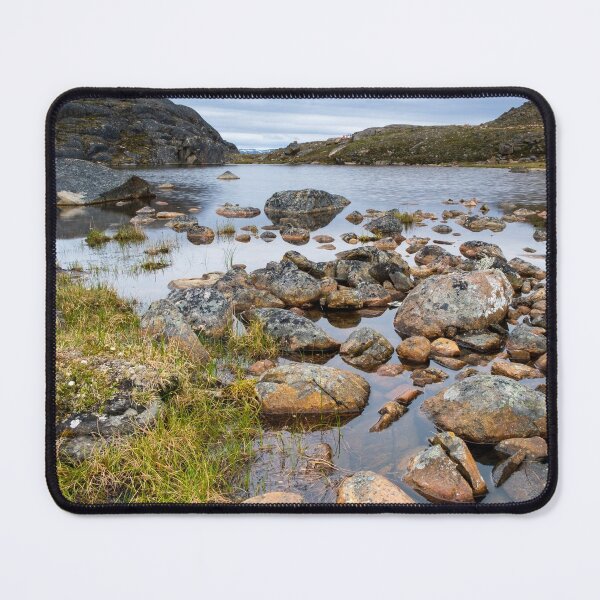 Item preview, Nunavut landscape - rocks next to a small lake with mountains at the background  designed and sold by VadimK.