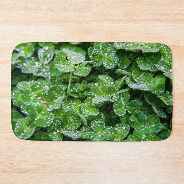 Item preview, Dew droplets of water covering green clover leaves designed and sold by James-Cole.