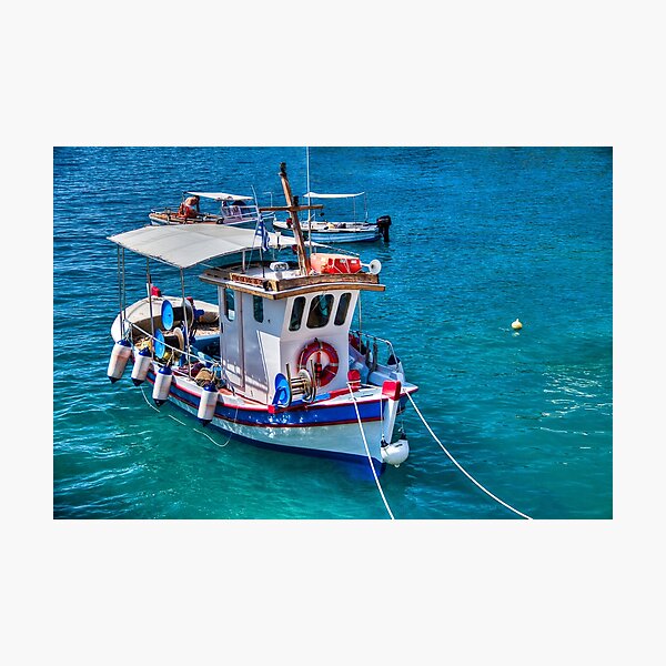 Poster Beautiful small fishing boat in Nafplio town in Greece 