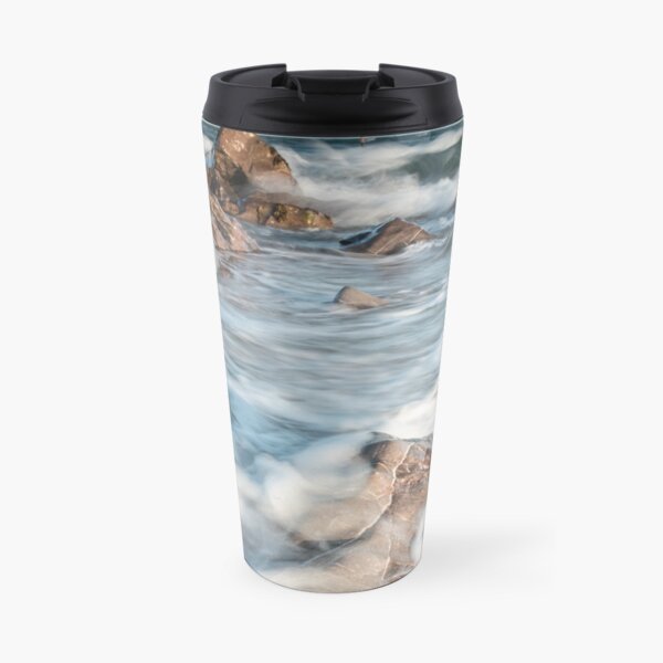 Waves breaking over rocks at sunset at Hayling island beach Travel Mug