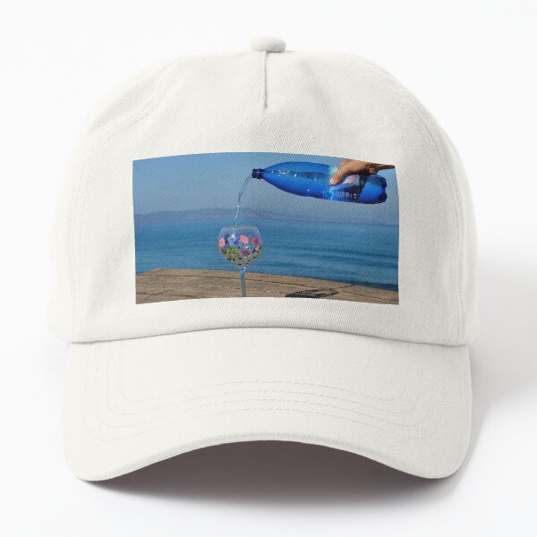 A steady hand pours sparkling water into a glass. Have a drink. Dad Hat