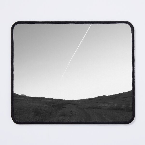 Item preview, Black and white scenic landscape photograph of a vapour trail disrupting the clearness of the sky and a dusty road with hill on each side designed and sold by Alahyane Said.