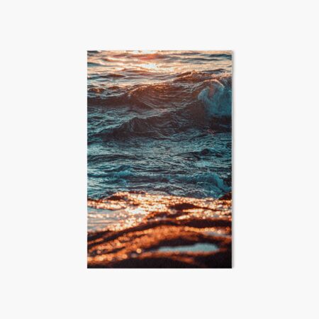 Water Waves on Brown Rocky Shore During Sunset Art Board Print