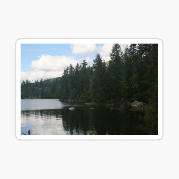 A boat on Strbske Pleso near the trees Sticker