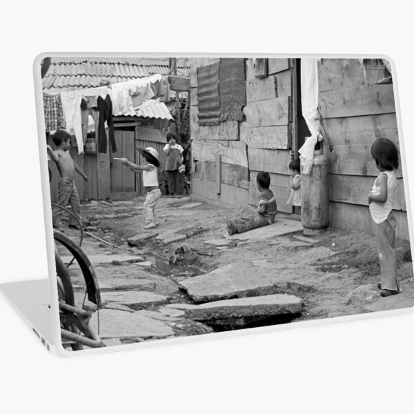 At Play in the alleys of "Shantytown" Laptop Skin