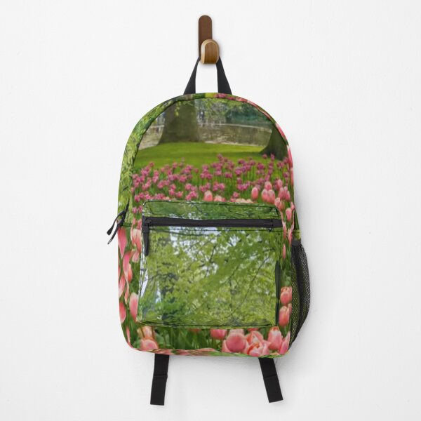 Item preview, Beautiful and relaxing European flowering garden in springtime with Pink Tulips and trees in the background designed and sold by LiveToLearn.
